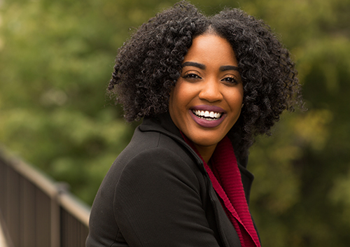 young professional with nice smile and curly hair