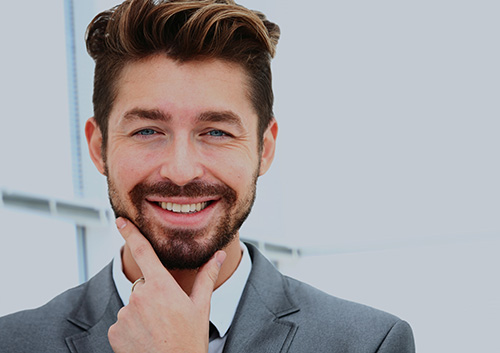 man with beard smiling